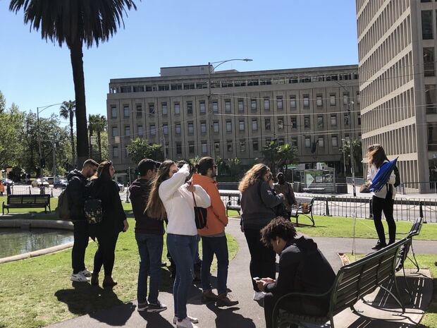 A guide with a tour group near Parliament in 2018